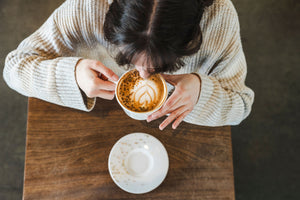 Woman drinking coffee in cafe